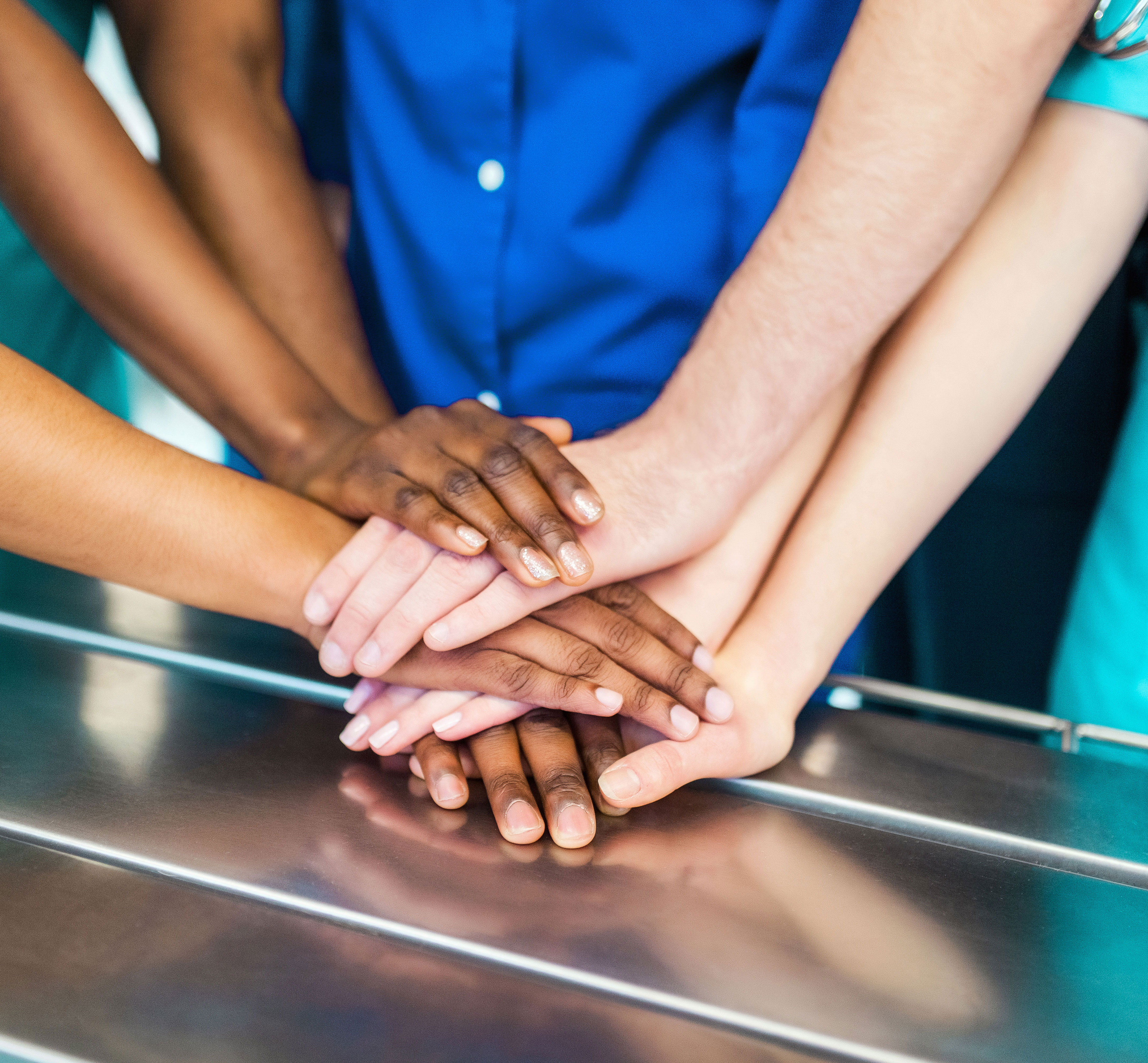 Nurses Putting Hands Together